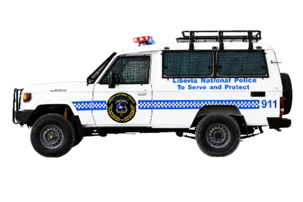 Toyota Land Cruiser 78 police vehicle with window guards and roof rack, side view